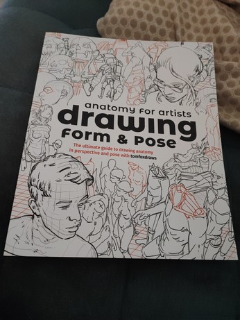 A white book with a variety of drawings of the human body in different poses on the cover, "anatomy for artists, drawing form and pose" by TomFoxDraws