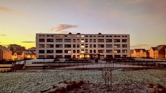 Sunrise hits a white building