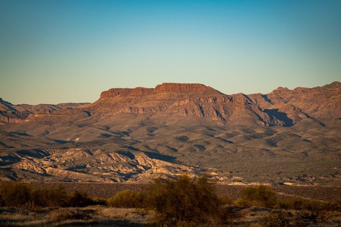 Saguaro catcus and the Galiuro mountains catch the setting sun.