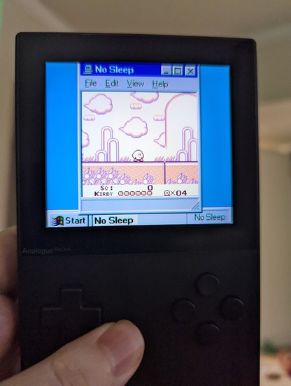 Black Analogue Pocket running the Super Game Boy 2: Vaporwave Edition mod. The border frames the game as a window running on a tiny Windows 95 desktop. The application name and system tray clock both read "No Sleep". The game being played is Kirby's Dream Land.