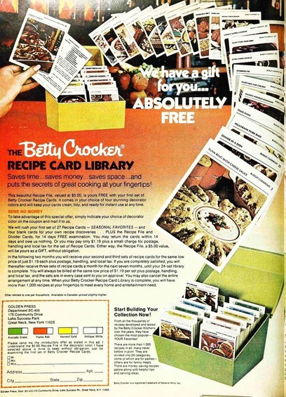 index cards with recipes spill out of a box in this advertisement.