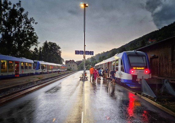 Train at the station in the evening rain 